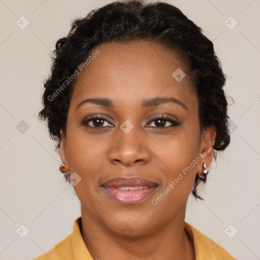 Joyful black young-adult female with long  brown hair and brown eyes