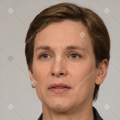 Joyful white adult female with short  brown hair and grey eyes