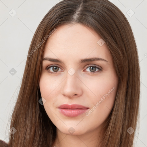 Neutral white young-adult female with long  brown hair and brown eyes