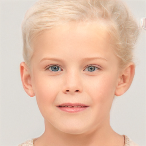 Joyful white child female with short  blond hair and blue eyes