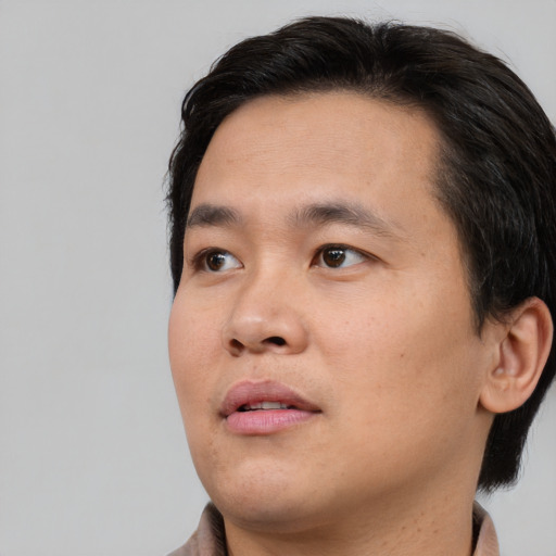 Neutral asian young-adult male with short  brown hair and brown eyes