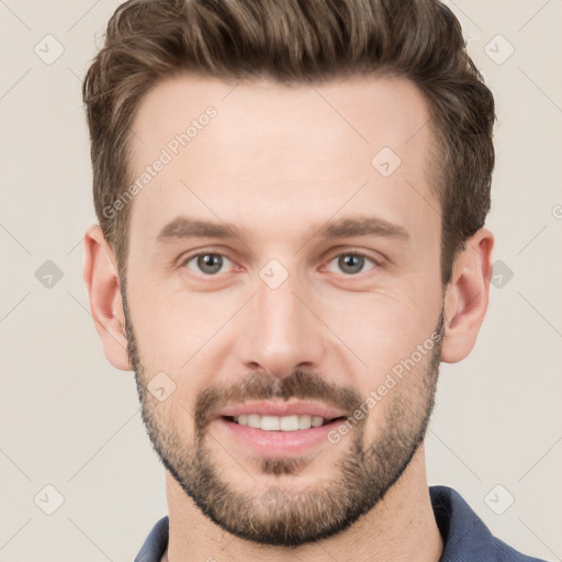 Joyful white young-adult male with short  brown hair and grey eyes