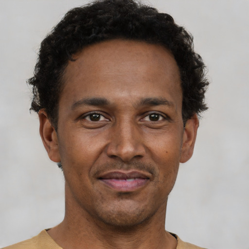 Neutral latino adult male with short  brown hair and brown eyes
