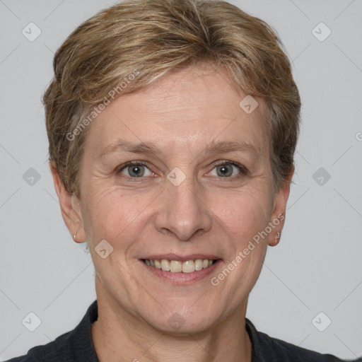 Joyful white adult female with short  brown hair and grey eyes