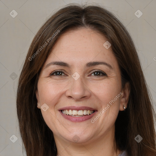 Joyful white adult female with long  brown hair and brown eyes