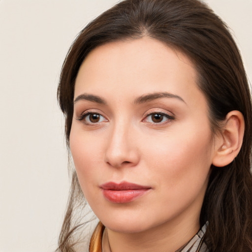 Neutral white young-adult female with long  brown hair and brown eyes