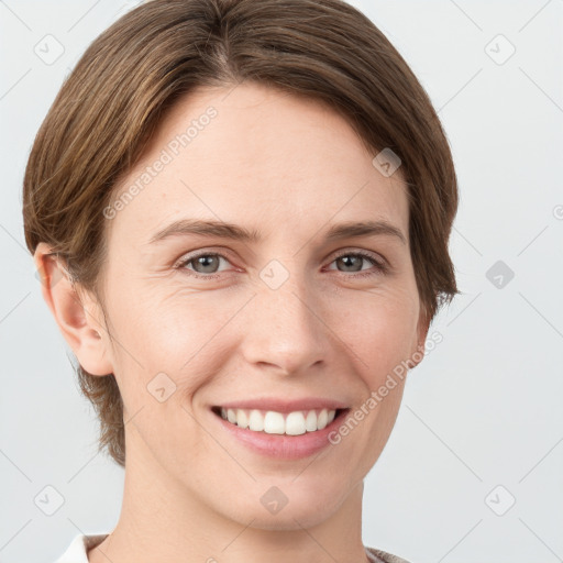 Joyful white young-adult female with short  brown hair and grey eyes