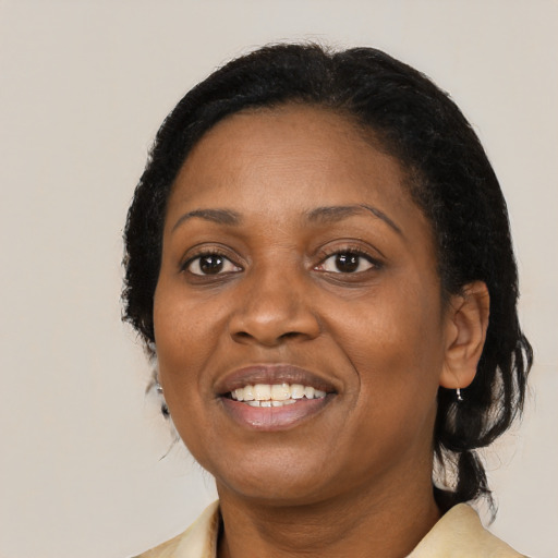 Joyful black young-adult female with medium  black hair and brown eyes