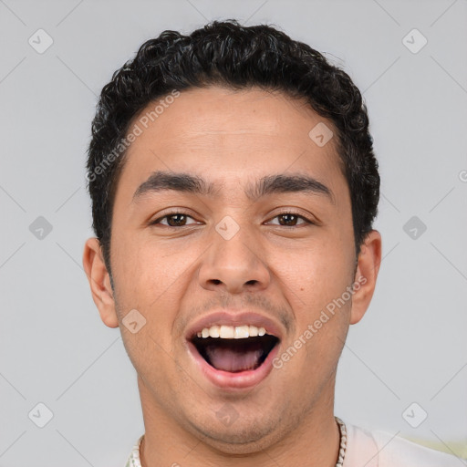 Joyful white young-adult male with short  black hair and brown eyes