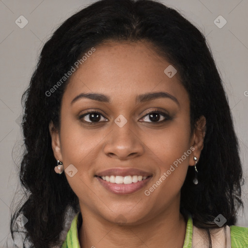 Joyful black young-adult female with long  brown hair and brown eyes