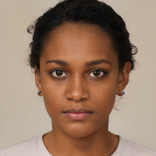 Neutral black young-adult female with short  black hair and brown eyes