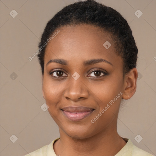 Joyful black young-adult female with short  brown hair and brown eyes