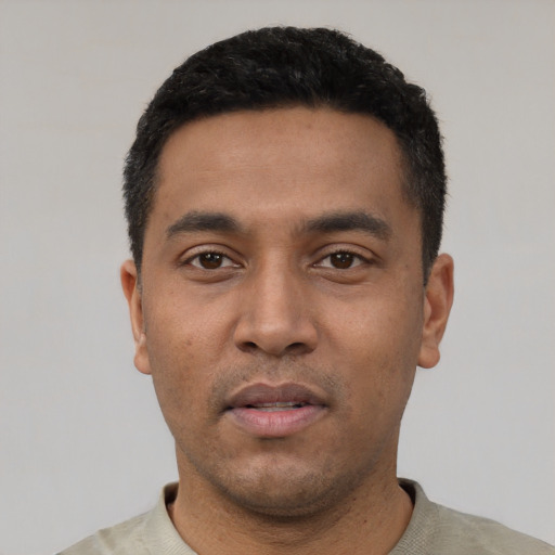 Neutral latino young-adult male with short  black hair and brown eyes