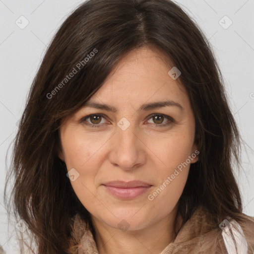 Joyful white adult female with long  brown hair and brown eyes