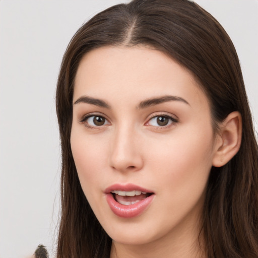 Neutral white young-adult female with long  brown hair and brown eyes