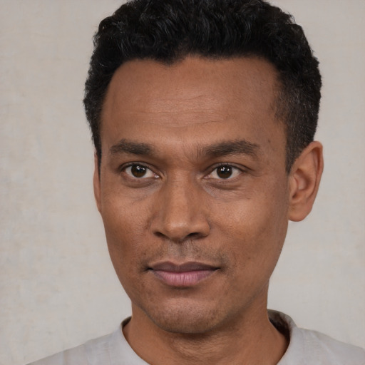 Neutral latino adult male with short  black hair and brown eyes