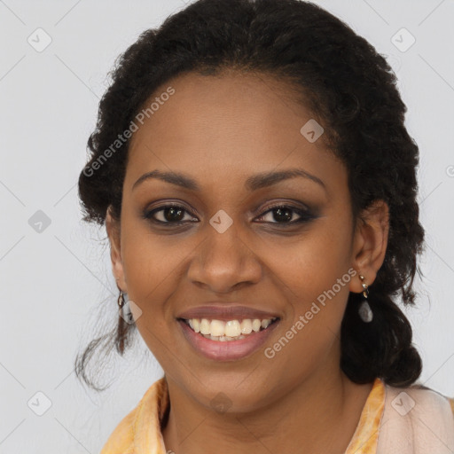 Joyful black young-adult female with long  brown hair and brown eyes