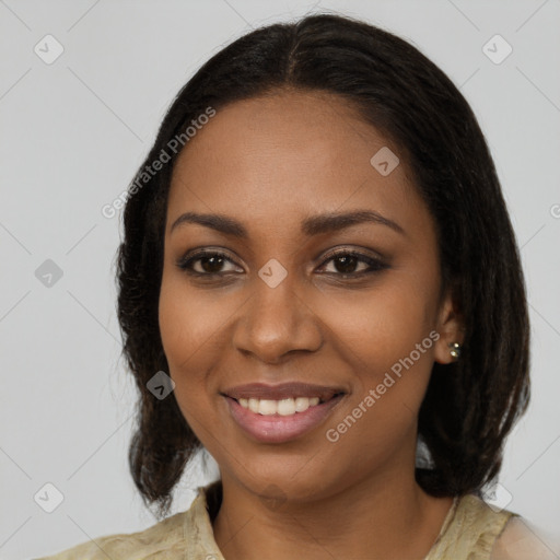 Joyful black young-adult female with medium  brown hair and brown eyes