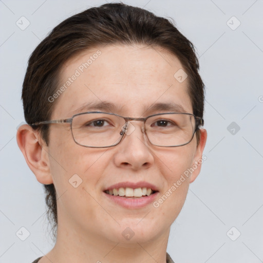 Joyful white adult female with short  brown hair and grey eyes