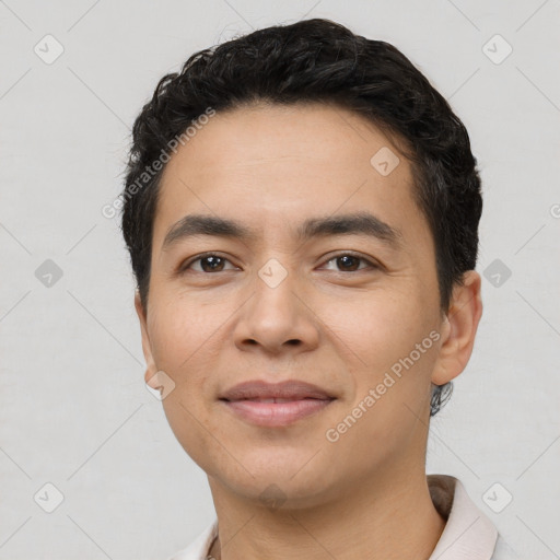 Joyful latino young-adult male with short  black hair and brown eyes