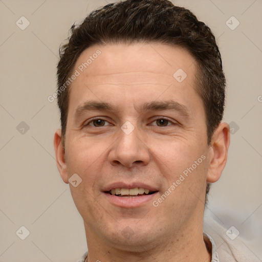 Joyful white adult male with short  brown hair and brown eyes