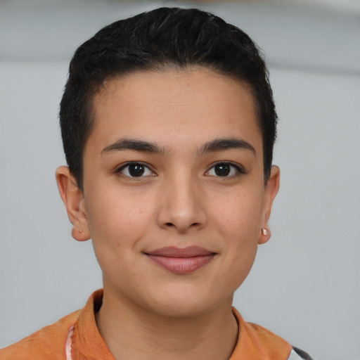 Joyful latino young-adult female with short  brown hair and brown eyes