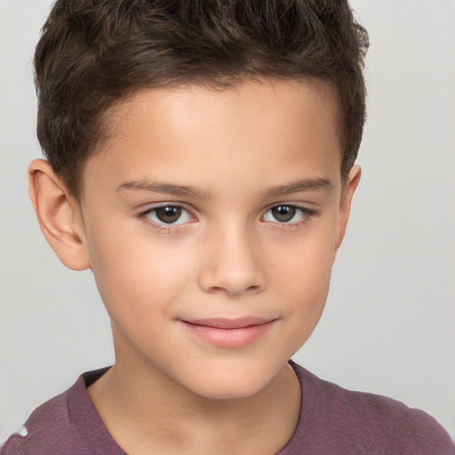 Joyful white child male with short  brown hair and brown eyes