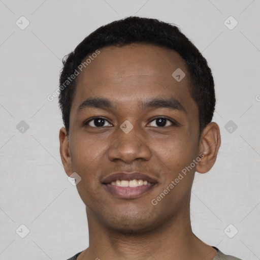 Joyful black young-adult male with short  black hair and brown eyes