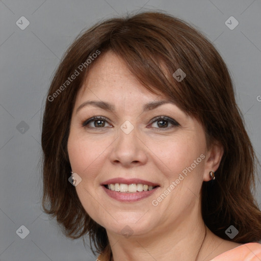 Joyful white adult female with medium  brown hair and brown eyes