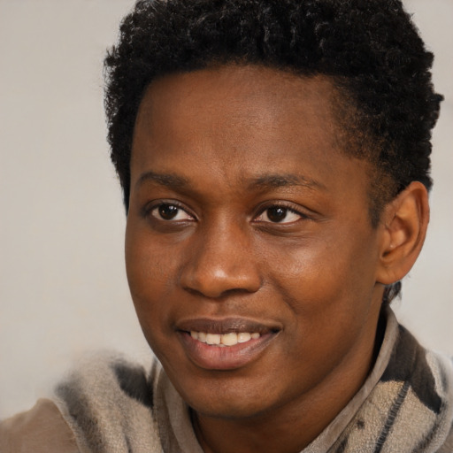 Joyful black young-adult male with short  brown hair and brown eyes
