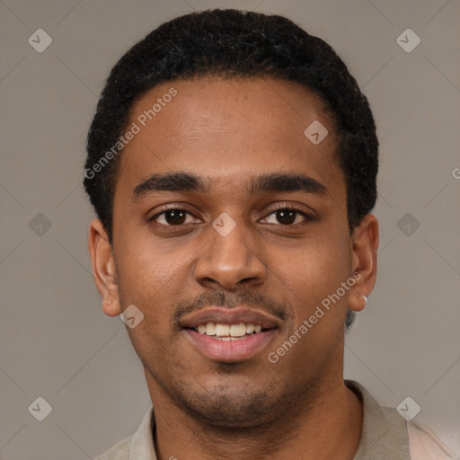 Joyful black young-adult male with short  black hair and brown eyes