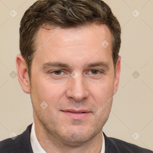 Joyful white adult male with short  brown hair and brown eyes