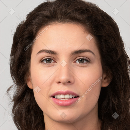 Joyful white young-adult female with long  brown hair and brown eyes