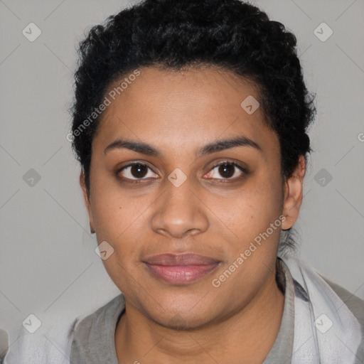 Joyful black young-adult female with short  black hair and brown eyes