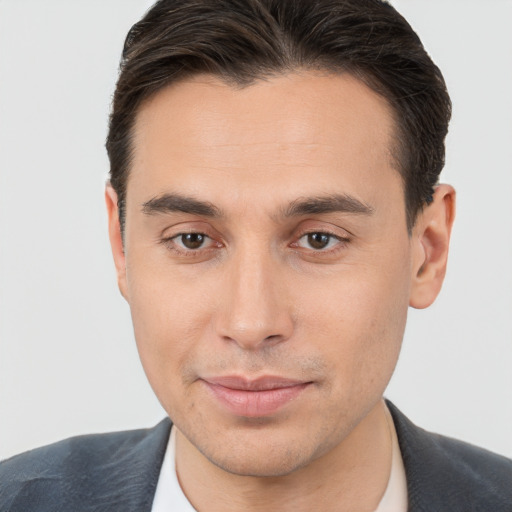 Joyful white young-adult male with short  brown hair and brown eyes