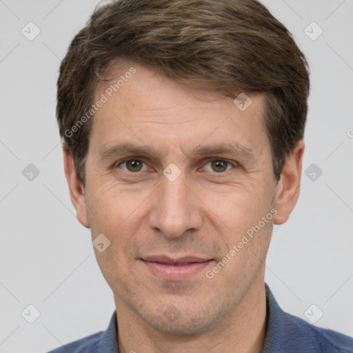 Joyful white adult male with short  brown hair and grey eyes