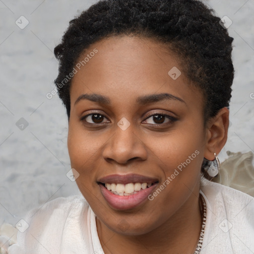 Joyful black young-adult female with short  brown hair and brown eyes