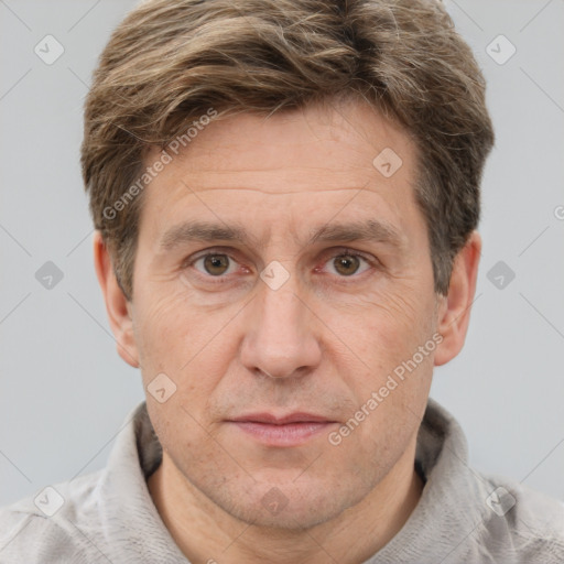 Joyful white adult male with short  brown hair and grey eyes