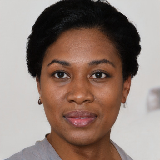 Joyful asian young-adult female with short  black hair and brown eyes