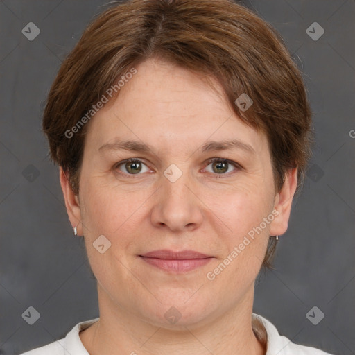 Joyful white adult female with short  brown hair and grey eyes