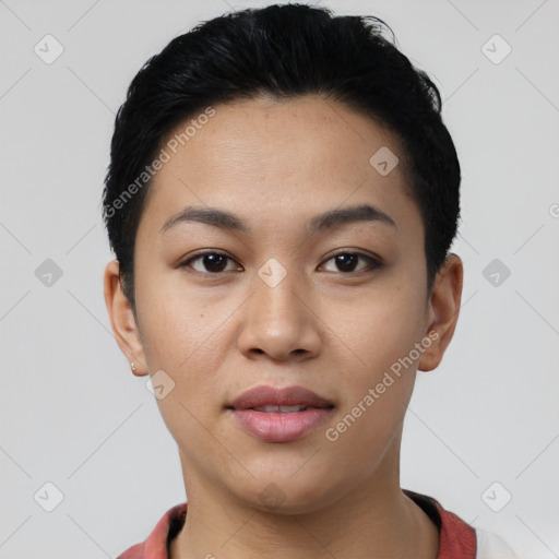 Joyful latino young-adult female with short  black hair and brown eyes