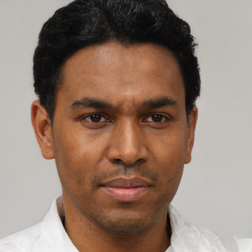 Neutral black young-adult male with short  black hair and brown eyes