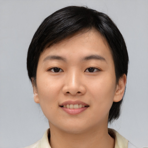 Joyful asian young-adult female with medium  black hair and brown eyes
