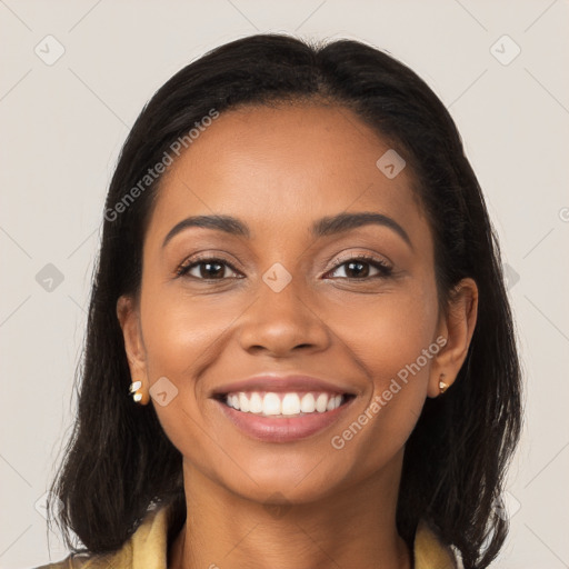 Joyful latino young-adult female with long  brown hair and brown eyes