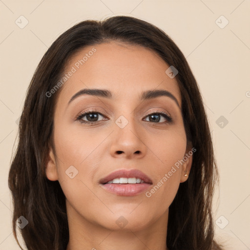 Joyful white young-adult female with long  brown hair and brown eyes