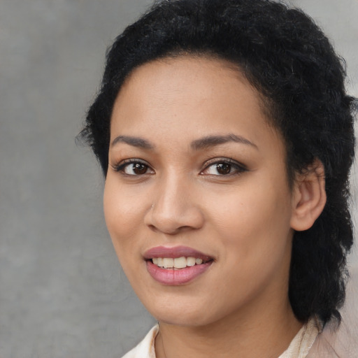 Joyful latino young-adult female with medium  black hair and brown eyes