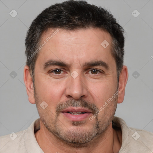 Joyful white adult male with short  brown hair and brown eyes