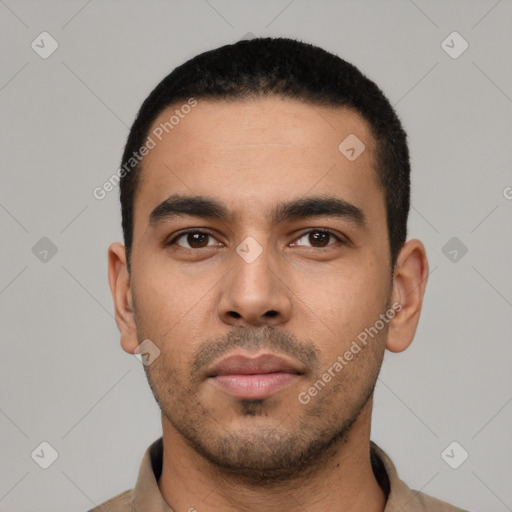 Neutral latino young-adult male with short  black hair and brown eyes
