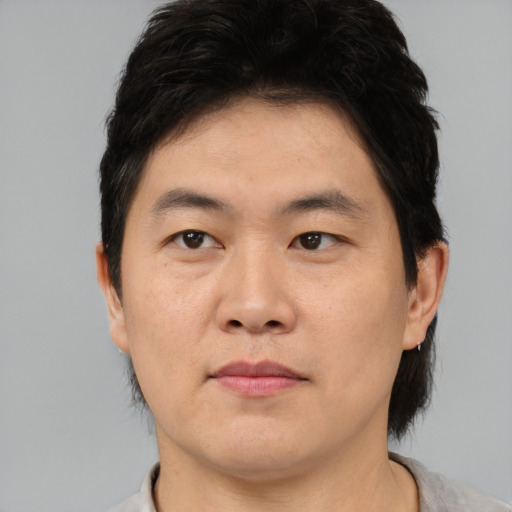 Neutral asian adult male with short  black hair and brown eyes