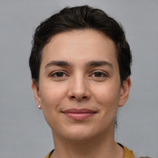 Joyful white young-adult female with short  brown hair and brown eyes